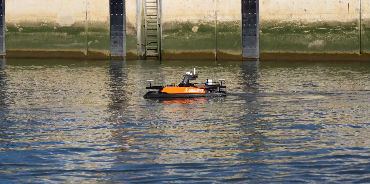 Autonomous surface vessel collecting data during a maritime inspection in the Port of Rotterdam.