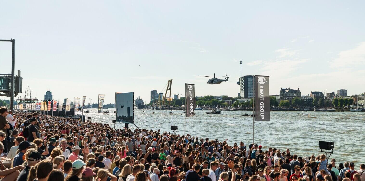 Crowds watching a helicopter demonstration during the World Port Days on the River Maas in Rotterdam.