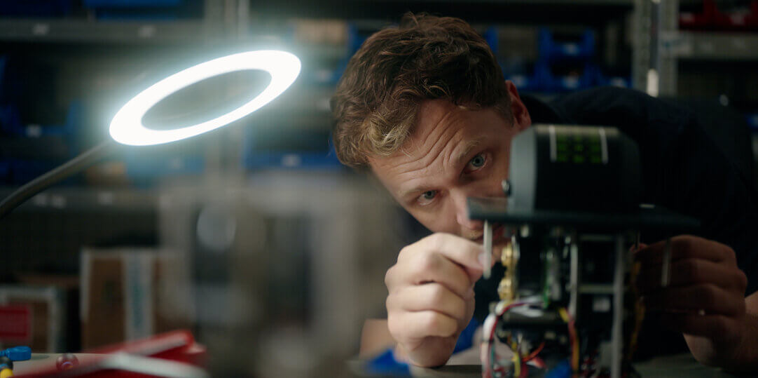 Roy from SmartShip carefully assembling propulsion control technology in the workshop.