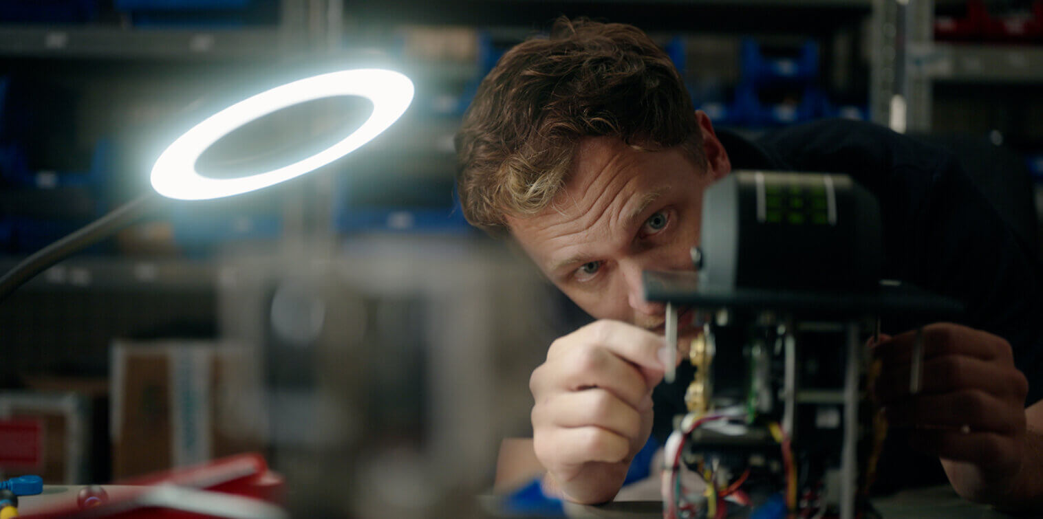 Roy from SmartShip carefully assembling propulsion control technology in the workshop.